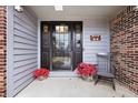 Charming front porch with decor, offering a warm welcome to this lovely home at 12205 Whitebark Dr, Indianapolis, IN 46236