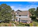 Aerial view of a home showcasing its manicured lawn and mature trees at 1322 N Alabama St # E, Indianapolis, IN 46202