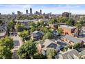Aerial view of residential neighborhood and downtown skyline on a sunny day at 1322 N Alabama St # E, Indianapolis, IN 46202