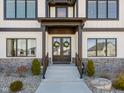 Welcoming front entrance adorned with seasonal wreaths, framed by stone accents and complemented by well-maintained landscaping at 3966 Chapel Hl Ct, Bargersville, IN 46106