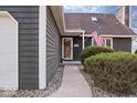 Inviting front entrance with an American flag and manicured bushes at 5595 Ridge Hill Way, Avon, IN 46123