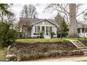 Charming home with a manicured lawn and inviting front porch, perfect for relaxing and enjoying the neighborhood at 5626 Winthrop Ave, Indianapolis, IN 46220