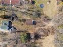 An aerial view of the home, revealing a spacious lot surrounded by mature trees and neighboring houses at 6724 E Spring Lake Rd, Mooresville, IN 46158