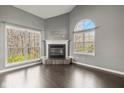 Bright living room features vaulted ceilings, a fireplace, and large windows at 6756 Shore Island Dr, Indianapolis, IN 46220