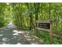 The scenic Marott Woods Nature Preserve trail for walking, hiking, and biking at 6756 Shore Island Dr, Indianapolis, IN 46220