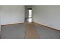 Bright living room with neutral carpet and a view to the entryway and back patio at 9150 Granville Ct, Indianapolis, IN 46229