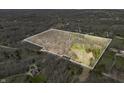 Expansive aerial view of the property showcasing the diverse landscape and outlined boundaries at 1828 W 750 S, Trafalgar, IN 46181