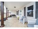 Charming covered front porch features a porch swing and comfortable seating, perfect for relaxing at 2109 Elmwood Dr, Lebanon, IN 46052