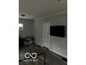 Cozy living room with a mounted TV and modern flooring at 2309 N Dearborn St, Indianapolis, IN 46218