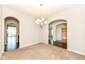 Elegant dining room featuring neutral walls, carpet floors and archways at 2564 Tangleridge Ln, Brownsburg, IN 46112