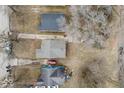Aerial view of property showcasing the roof, yard, and driveway with car parked at 3829 N Temple Ave, Indianapolis, IN 46205