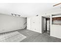 Spacious living room with neutral carpet, white walls, stairs, with lots of natural light and open floor plan at 3986 Braddock Rd, Indianapolis, IN 46268