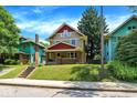 Beautiful craftsman home, featuring a well-maintained lawn and colorful neighboring houses at 4029 Broadway St, Indianapolis, IN 46205