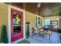 Inviting front porch featuring comfortable seating and stylish decor at 4029 Broadway St, Indianapolis, IN 46205