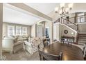 Inviting living room featuring comfortable seating, a staircase, and abundant natural light at 4947 Cherryhill Ct, Indianapolis, IN 46254