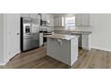 Bright kitchen featuring stainless steel appliances, granite countertops, and an island with a breakfast bar at 5147 Gerhing Dr, Indianapolis, IN 46239