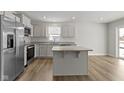 Bright kitchen featuring stainless steel appliances, granite countertops, and an island with a breakfast bar at 5147 Gerhing Dr, Indianapolis, IN 46239