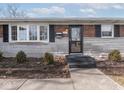 Close up of the front entrance of this brick home, with a nice bay window at 5312 Daniel Dr, Indianapolis, IN 46226