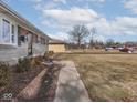 A lovely walkway leads to the front entrance of this well-maintained home at 5312 Daniel Dr, Indianapolis, IN 46226