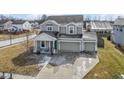Inviting two-story home with attached two car garage, covered porch and well-kept landscaping at 6705 Park Grove Blvd, Whitestown, IN 46075