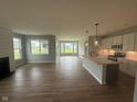 Open concept living space features a modern kitchen and lots of natural light at 7227 Bailow Ct, McCordsville, IN 46055