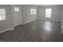 Bright and airy living room with modern wood-look floors and neutral paint at 952 N Concord St, Indianapolis, IN 46222