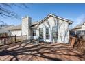 Enjoy outdoor living on this wood deck, complete with seating area and overlooking a private backyard at 9667 Overcrest Dr, Fishers, IN 46037