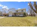 Two-story home with a stone-accented garage and a well-maintained lawn at 101 Aspen Way, Noblesville, IN 46062