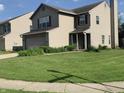 Attractive two-story home with a well-manicured lawn and traditional design, offering comfort and curb appeal at 10419 Dark Star Dr, Indianapolis, IN 46234