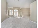 Bright, open-concept living area featuring neutral tones and ample natural light, perfect for entertaining at 10944 Haig Point Dr, Fishers, IN 46037