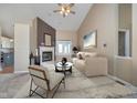 Cozy living room featuring a fireplace, modern furniture, neutral tones and plenty of natural light at 10944 Haig Point Dr, Fishers, IN 46037
