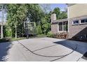 Backyard view with a basketball court, chimney, and space for outdoor activities at 14335 Stella Ct, Fishers, IN 46040