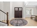 Spacious foyer with wooden floors, high ceilings, and a striking round rug at 14335 Stella Ct, Fishers, IN 46040