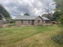 Spacious backyard with a well-manicured lawn and a small wooden deck at 145 Goodnight Rd, Martinsville, IN 46151