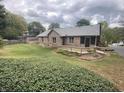 Scenic backyard featuring a wooden deck and lush greenery, creating a serene outdoor space at 145 Goodnight Rd, Martinsville, IN 46151