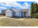 Charming home featuring a well-maintained lawn, attached garage, and inviting curb appeal at 19215 Calico Aster Dr, Noblesville, IN 46062