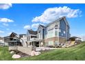 Large backyard with a hot tub, basketball hoop, and outdoor seating area at 20451 Chatham Hills Blvd, Westfield, IN 46074