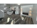Bright, open-concept living room with fireplace and modern island kitchen at 2306 Finley Ave, Indianapolis, IN 46203