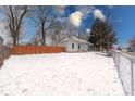 A charming home with a quaint covered porch and a spacious yard at 2639 E Brookside Ave, Indianapolis, IN 46218