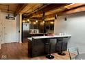 Modern kitchen featuring stainless steel appliances and an island with bar seating at 430 N Park Ave # 510, Indianapolis, IN 46202