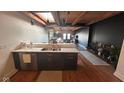 Modern kitchen featuring granite countertops and stainless steel dishwasher at 430 N Park Ave # 510, Indianapolis, IN 46202