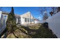 Fenced backyard with a concrete patio area and plenty of sunlight at 5455 Lalista Ct, Indianapolis, IN 46254