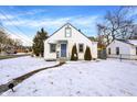 Beautiful house featuring tidy landscaping and a blue front door at 5502 Rawles Ter, Indianapolis, IN 46219