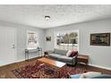 Inviting living room with cozy seating, natural light, and stylish decor at 5502 Rawles Ter, Indianapolis, IN 46219