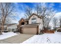 Attractive two-story home features attached garage and traditional design elements at 602 Burr Oak Dr, Carmel, IN 46032