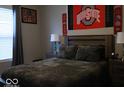 Bedroom featuring a queen bed with decorative pillows, side tables, and a neutral color scheme at 7349 Doyal Dr, Whitestown, IN 46075