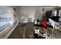 Living room with large window; room is prepped and undergoing renovations at 7643 S Delaware St, Indianapolis, IN 46227