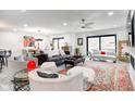 Bright, spacious living room with modern furnishings and large windows at 8545 Olde Ml Trce, Indianapolis, IN 46260