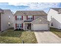 Beautiful two-story home with brick accents, red shutters, and a spacious two-car garage at 11005 Long Lake Ln, Fishers, IN 46037