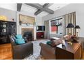 Cozy living room features a fireplace, comfortable seating, and ample natural light at 12916 Tradd St, Carmel, IN 46032